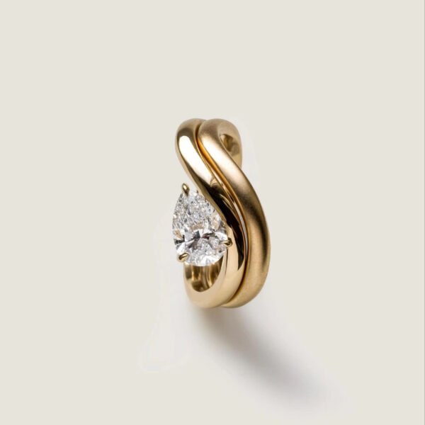 Pear Cut Twist Solitaire Ring